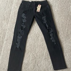 Black slim tapered 34 by 34 ripped Levi jeans